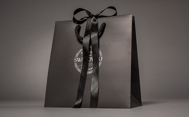 Printed paper gift bag with gift bow