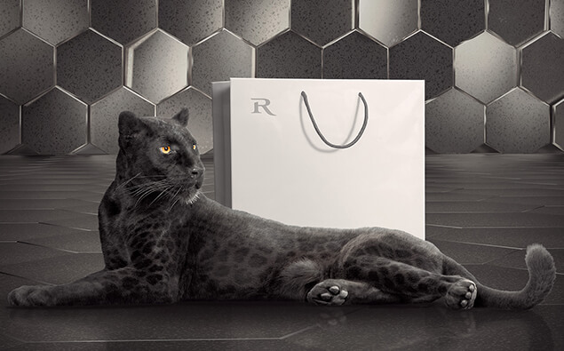 RIEDLE brand image panther lying in front of paper bag